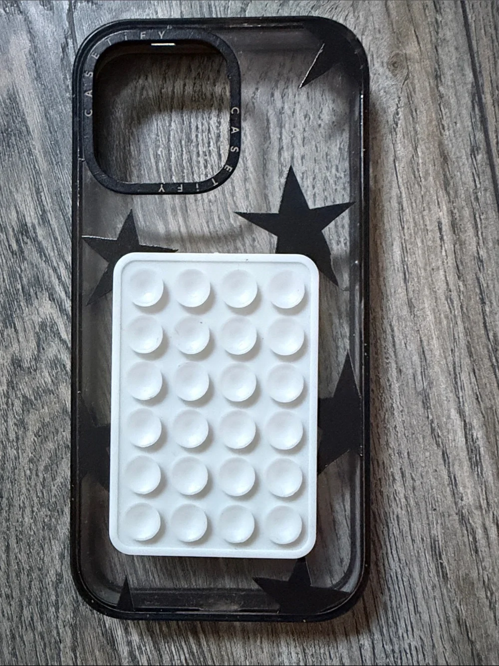 Casetify Clear Case with Black Star Design and White PopGrip